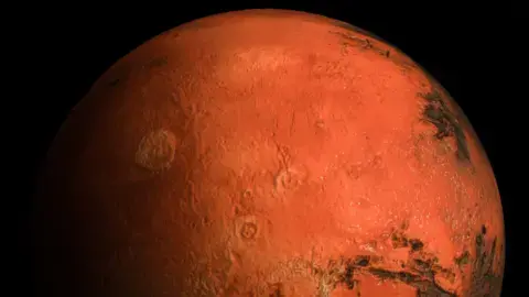 گِتی ایمیجز – این تصویر یک نمای نزدیک سهبعدی با وضوح بالا از سیاره مریخ است که سطح خشن، زمین سرخرنگ و ویژگیهای جزئی زمینشناسی دقیق آن را نشان میدهد