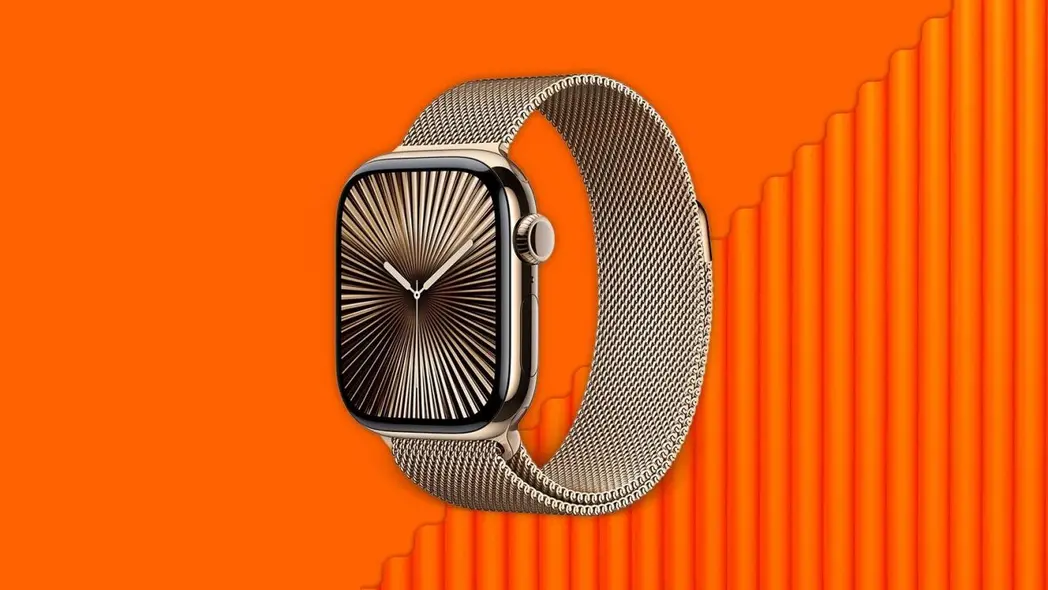 ساعت Apple Watch طلا با بند مش در پسزمینه نارنجی زنده